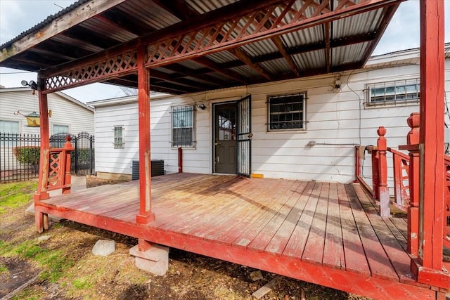 wooden terrace featuring central AC and fence