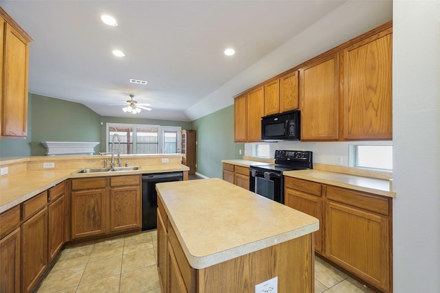 kitchen featuring brown cabinets, light tile patterned floors, light countertops, a sink, and black appliances