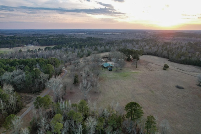 birds eye view of property with a wooded view