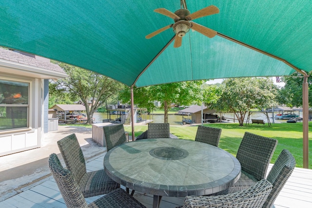 view of patio / terrace with a ceiling fan and outdoor dining space