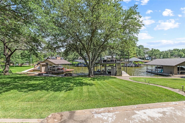 exterior space featuring a dock, a water view, and boat lift