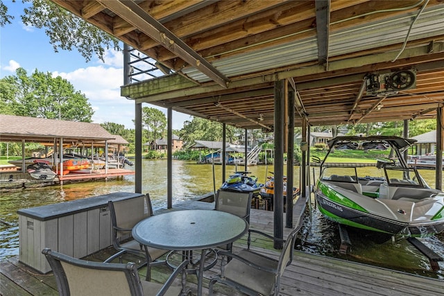 view of dock featuring a water view and boat lift