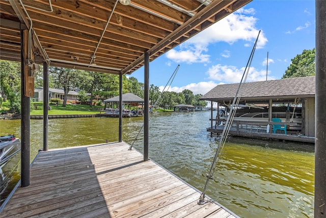 view of dock featuring a water view and boat lift