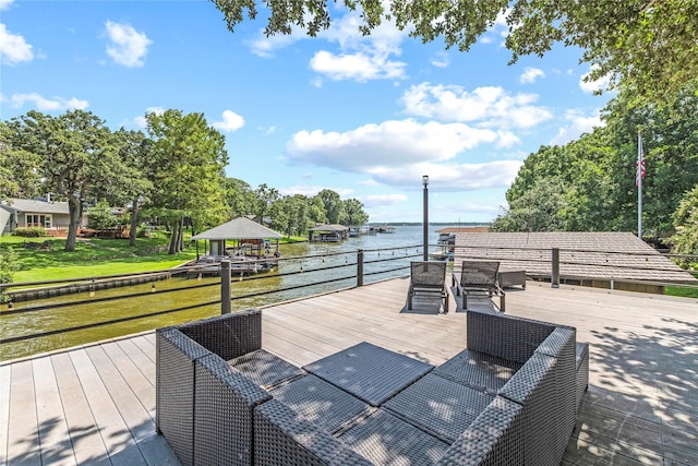 exterior space with a deck with water view