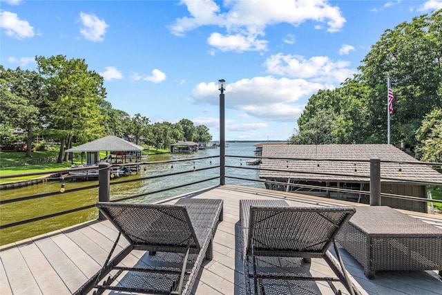 deck featuring a water view