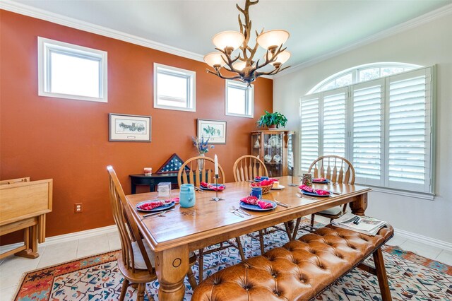 dining room featuring baseboards, an inviting chandelier, light tile patterned flooring, and crown molding