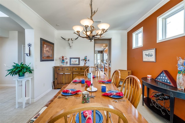 dining space featuring a wealth of natural light, an inviting chandelier, and light tile patterned flooring