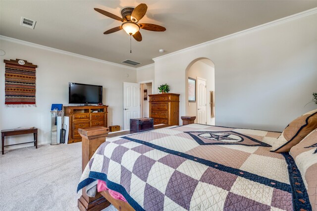 bedroom featuring arched walkways, visible vents, light colored carpet, and crown molding