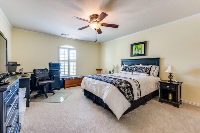 bedroom featuring ceiling fan, visible vents, light colored carpet, and ornamental molding