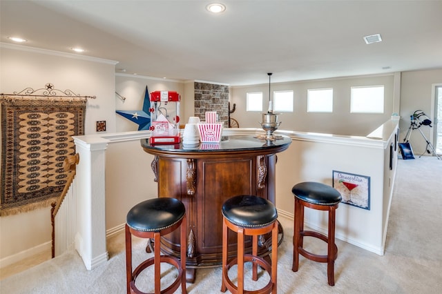 bar featuring recessed lighting, baseboards, light carpet, and crown molding