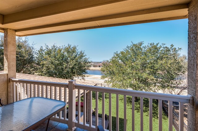 balcony featuring a water view