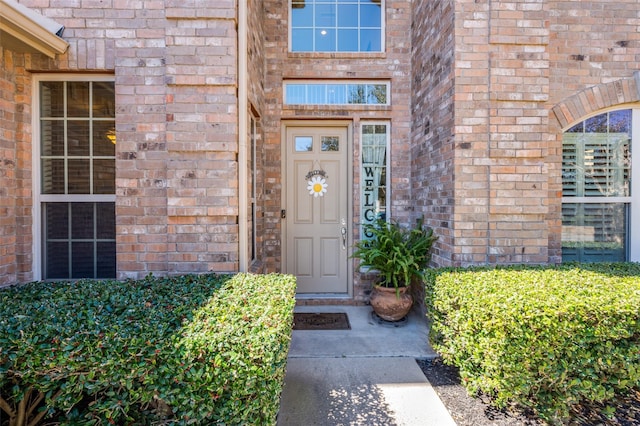 property entrance with brick siding