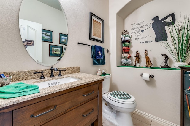 8912 Landmark Ln, Denton, TX 76207 - bathroom with vanity, toilet, tile patterned floors, and baseboards
