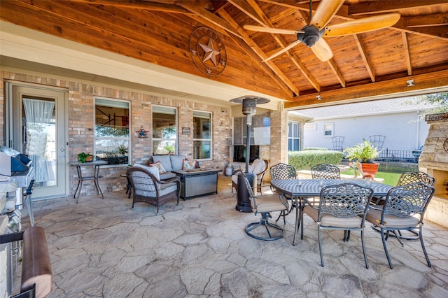8912 Landmark Ln, Denton, TX 76207 - view of patio / terrace with outdoor dining space, an outdoor living space with a fireplace, and a ceiling fan