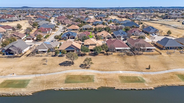 bird's eye view featuring a residential view and a water view