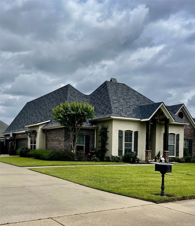 162 Captain Hm Shreve, Shreveport, LA 71115 - view of front of property featuring stucco siding, a front lawn, and a shingled roof