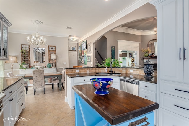 162 Captain Hm Shreve, Shreveport, LA 71115 - kitchen featuring a sink, arched walkways, ornamental molding, stainless steel dishwasher, and light tile patterned flooring