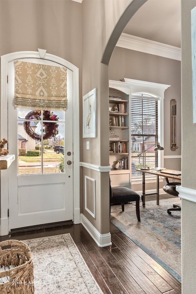162 Captain Hm Shreve, Shreveport, LA 71115 - entrance foyer with arched walkways, ornamental molding, dark wood-type flooring, and baseboards