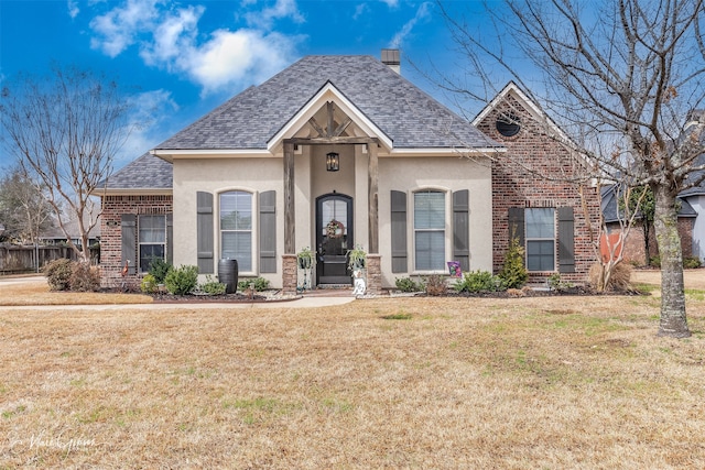 162 Captain Hm Shreve, Shreveport, LA 71115 - french provincial home with a shingled roof, brick siding, a chimney, and stucco siding