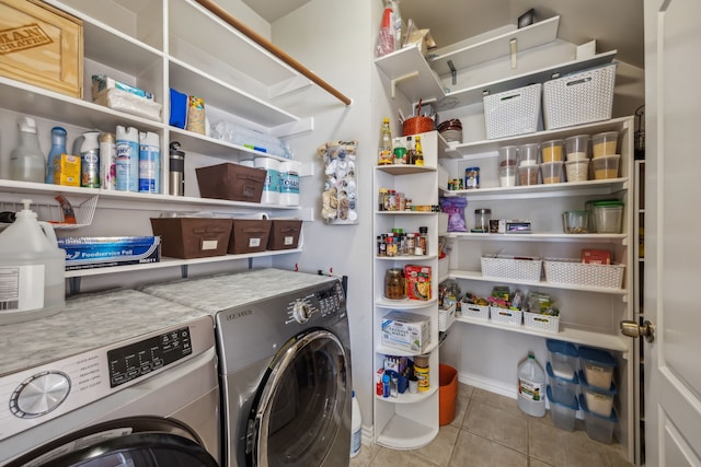 laundry area with laundry area, tile patterned flooring, and washer and clothes dryer