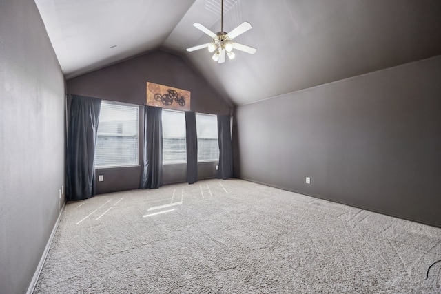 interior space featuring high vaulted ceiling, carpet, ceiling fan, and baseboards