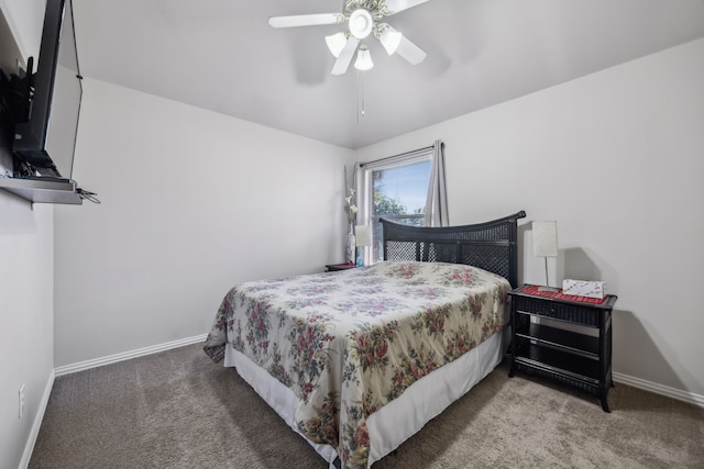 bedroom featuring a ceiling fan, carpet flooring, and baseboards