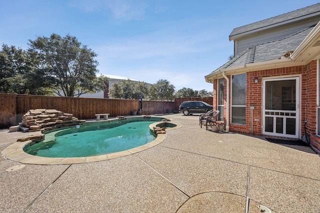 view of pool featuring a fenced backyard, a fenced in pool, and a patio