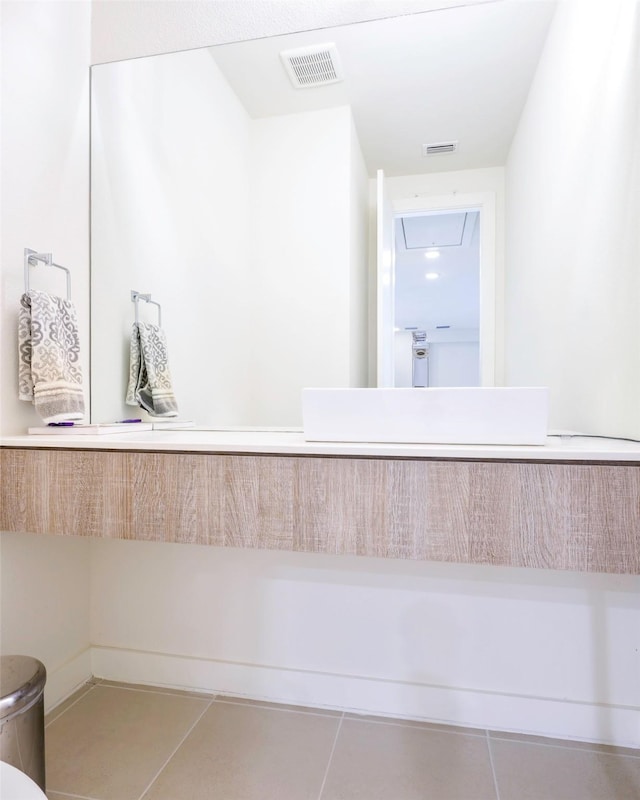 bathroom featuring visible vents and tile patterned flooring