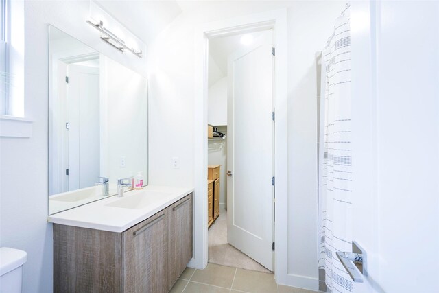 full bath with tile patterned flooring, toilet, and vanity