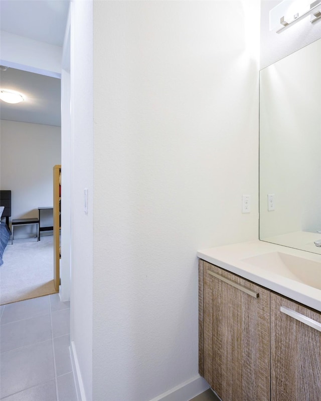 bathroom with vanity and tile patterned floors