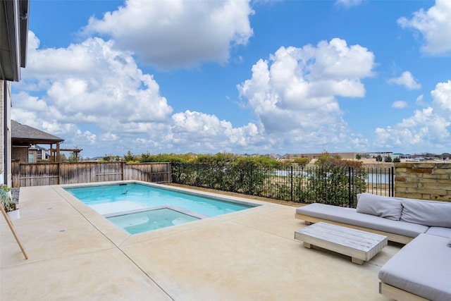 view of swimming pool featuring a patio, an in ground hot tub, and a fenced backyard