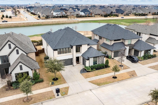 aerial view with a residential view and a water view