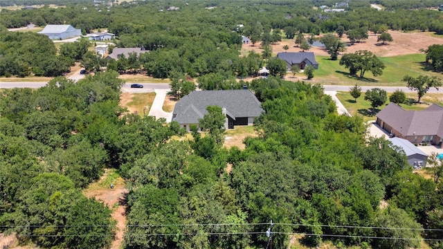 birds eye view of property featuring a residential view and a view of trees