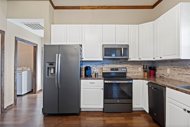 kitchen with washer / dryer, visible vents, dark wood-style floors, and appliances with stainless steel finishes