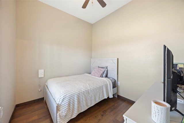 bedroom with ceiling fan, baseboards, and wood finished floors