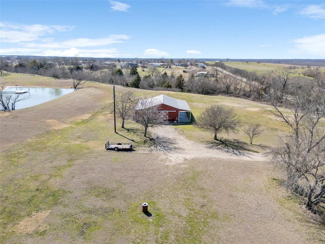 bird's eye view featuring a water view and a rural view