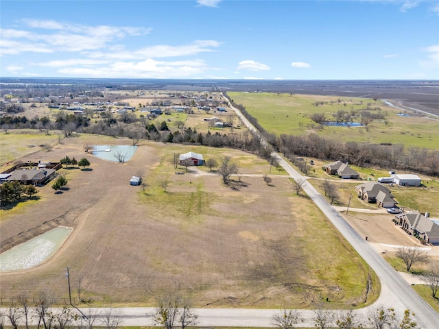 drone / aerial view with a water view and a rural view