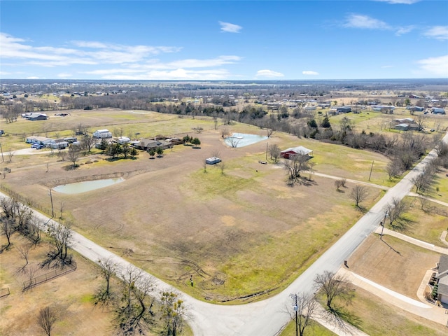 bird's eye view with a rural view and a water view