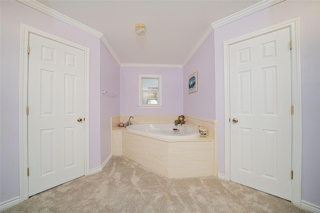 bathroom with baseboards, carpet, ornamental molding, and a bath