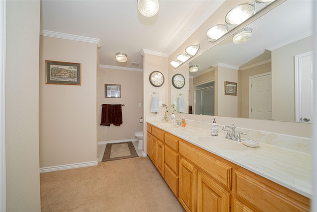 full bathroom featuring crown molding, double vanity, a stall shower, a sink, and baseboards