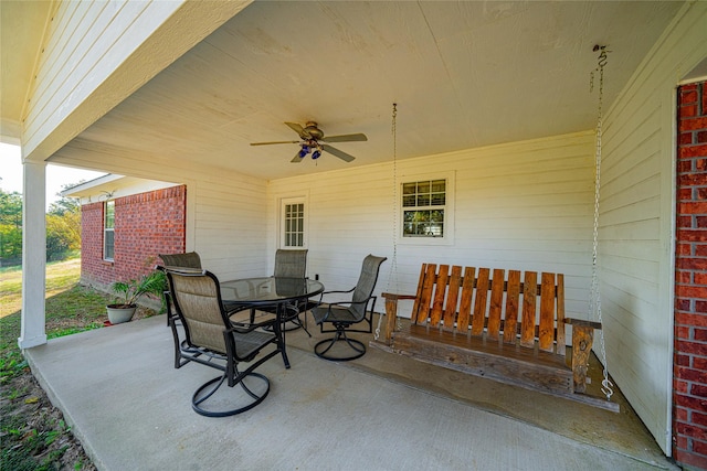 view of patio with a ceiling fan and outdoor dining space