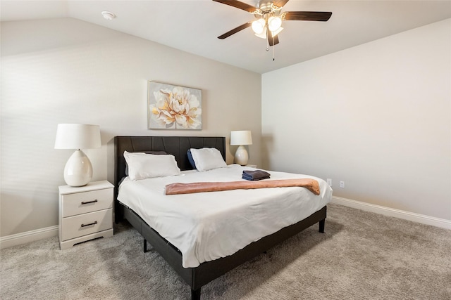 bedroom with lofted ceiling, light carpet, ceiling fan, and baseboards