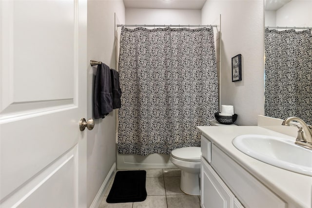 bathroom with vanity, toilet, and tile patterned floors