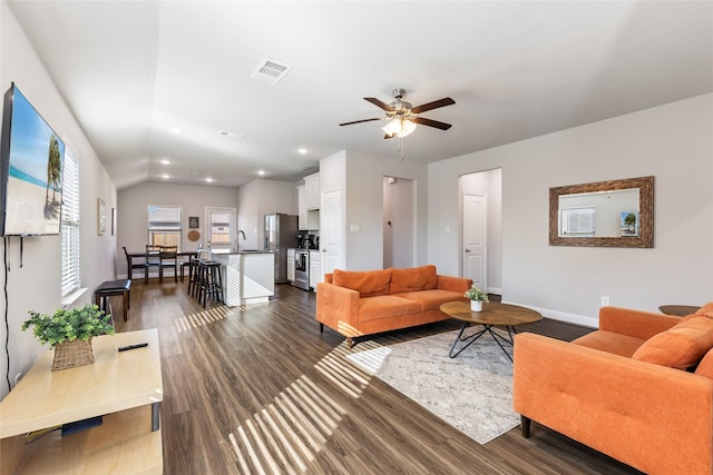 living area with ceiling fan, recessed lighting, visible vents, baseboards, and dark wood-style floors