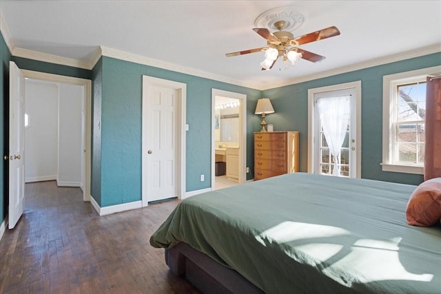 bedroom featuring ceiling fan, wood finished floors, baseboards, ensuite bath, and crown molding