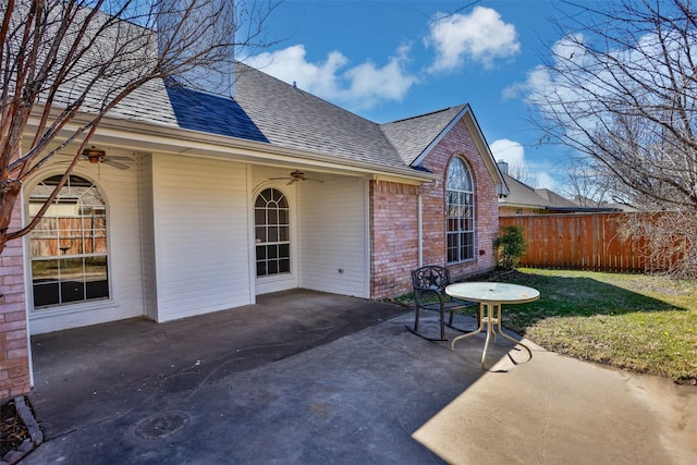 view of patio with a ceiling fan and fence