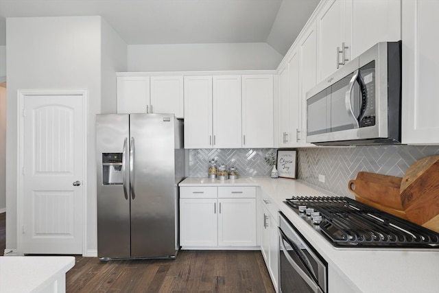 kitchen featuring tasteful backsplash, dark wood-style floors, appliances with stainless steel finishes, white cabinets, and light countertops