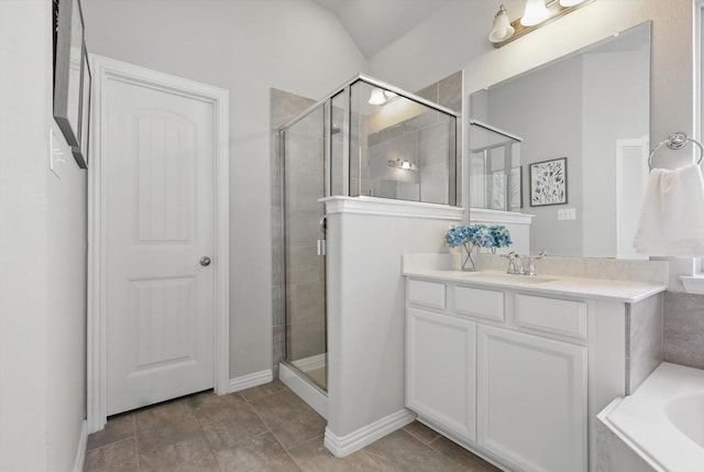 full bathroom featuring tile patterned floors, a stall shower, vanity, and a bath