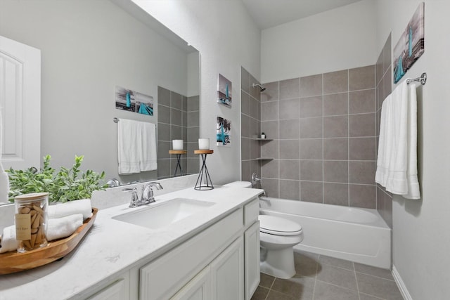 bathroom with tile patterned floors, shower / bathtub combination, toilet, and vanity