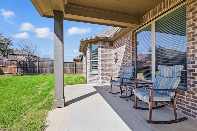 view of patio / terrace featuring fence